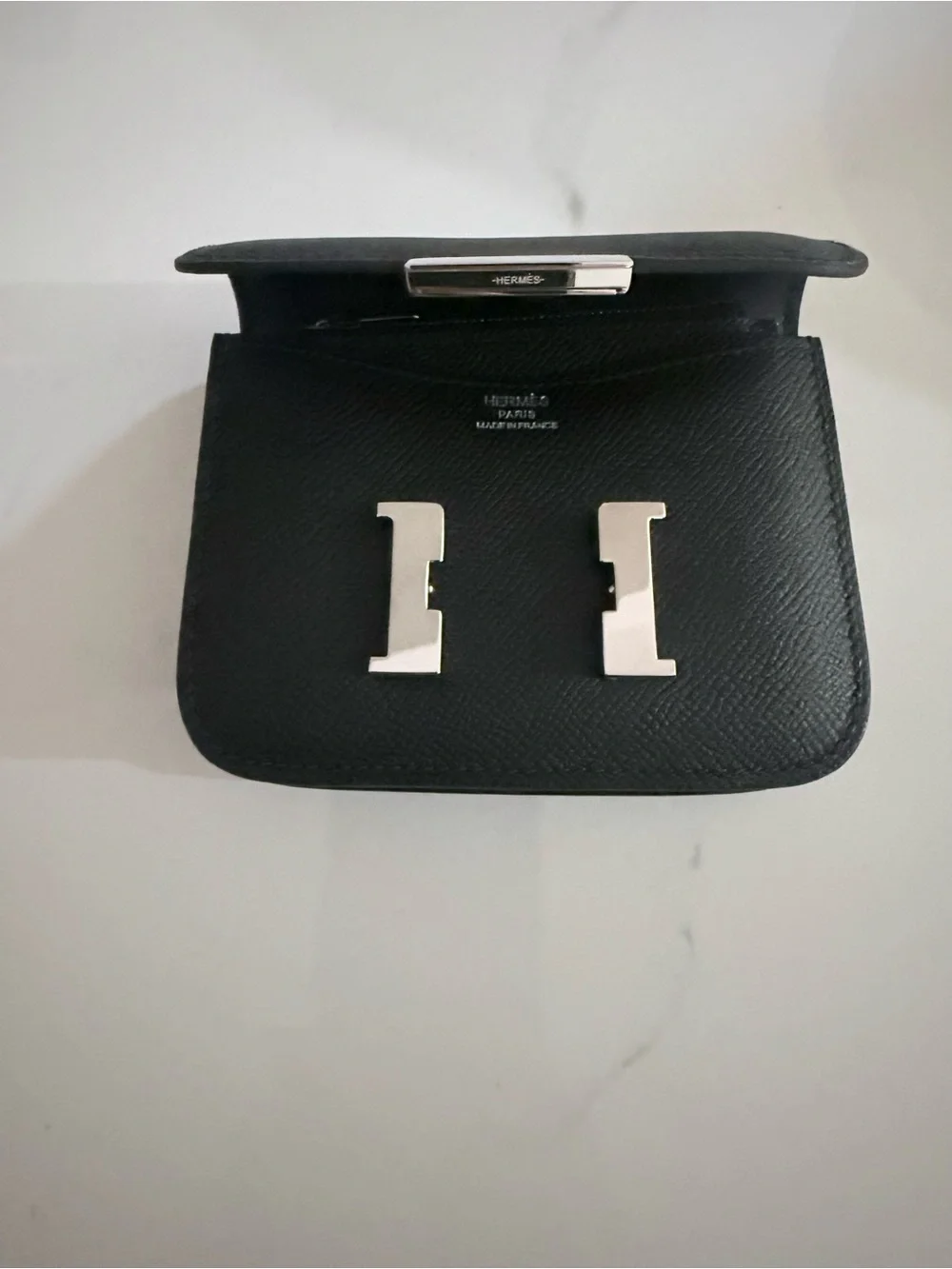 GRAY SLIM WALLET BELT WITH SILVER HARDWARE.